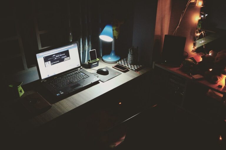 black-laptop-beside-black-computer-mouse-inside-room-669996