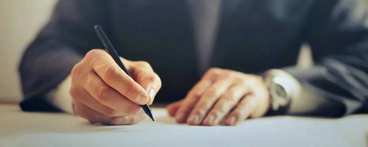 Man signing an acceptable use policy